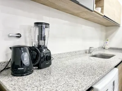 a blender sitting on a counter in a kitchen at Edificio Darwin in Villa Carlos Paz