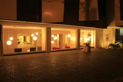 a building with windows with lights and a room at HOTEL CONTINENTAL PLAZA in Villa Carlos Paz