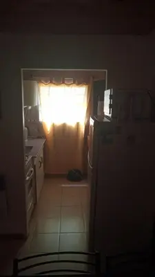 a kitchen with a light shining through a window at Sol Naciente in Potrero de Garay