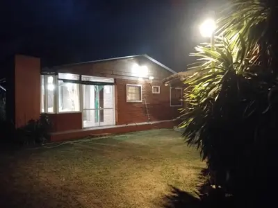 a house at night with a street light at Sol Naciente in Potrero de Garay