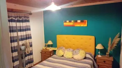 a bedroom with a bed with two pillows on it at Sol Naciente in Potrero de Garay