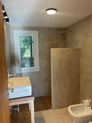 a bathroom with a sink and a toilet at La Franca Aparts in Villa General Belgrano
