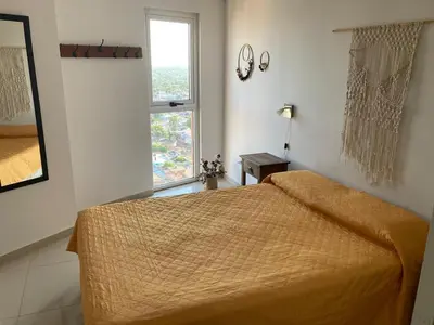 a bedroom with a bed and a window at TORRES H in Cordoba