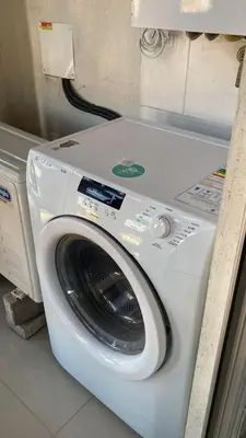 a washing machine is sitting in a room at TORRES H in Cordoba