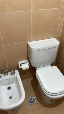 a bathroom with a white toilet and a sink at TORRES H in Cordoba
