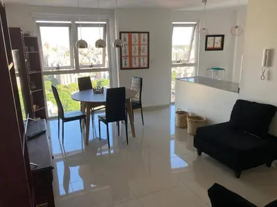 a kitchen and dining room with a table and chairs at TORRES H in Cordoba