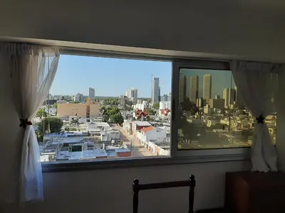 a large window with a view of a city at Departamento MeR in Río Cuarto