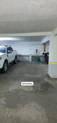 an empty parking garage with a car parked in it at Departamento MeR in Río Cuarto