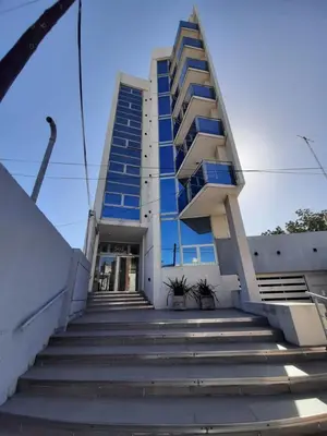 a building with stairs leading up to it at Departamento MeR in Río Cuarto