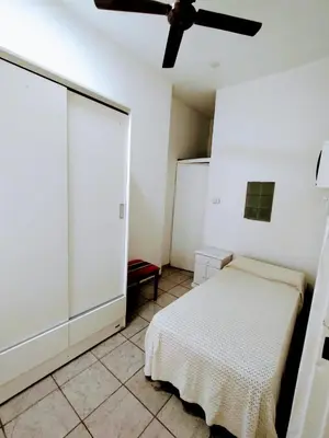 a bedroom with a bed and a ceiling fan at Habitacion con baño privado in Cordoba