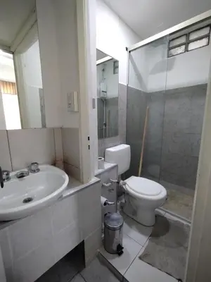 a bathroom with a sink and a toilet and a shower at Habitacion con baño privado in Cordoba