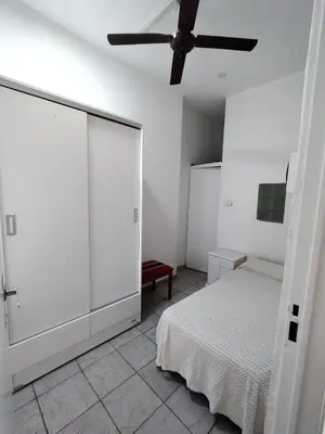 a bedroom with a bed and a ceiling fan at Habitacion con baño privado in Cordoba