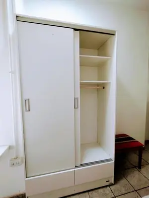 an empty white cabinet in a room at Habitacion con baño privado in Cordoba