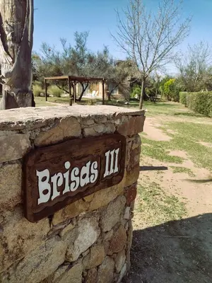 a stone wall with a sign that reads brasils iii at Brisas de Chacras in San Javier