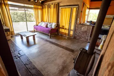 a living room with a couch and a table at Brisas de Chacras in San Javier