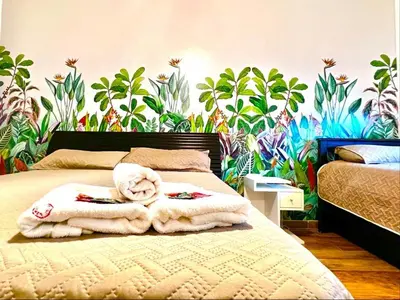 a bedroom with a bed with towels on it at Departamento Bolivar in Cordoba