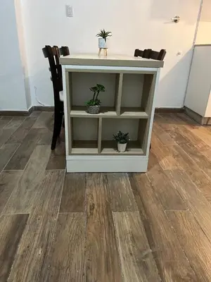 a white cabinet with two potted plants on it at Departamento Bolivar in Cordoba