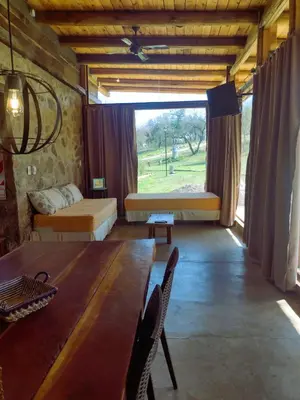 a living room with a table and a large window at La Comarca in San Javier