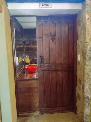 an entrance to a room with a wooden door at La Comarca in San Javier