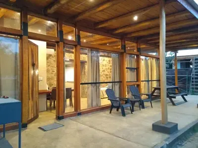 a house under construction with chairs and a table at La Comarca Loft in San Javier