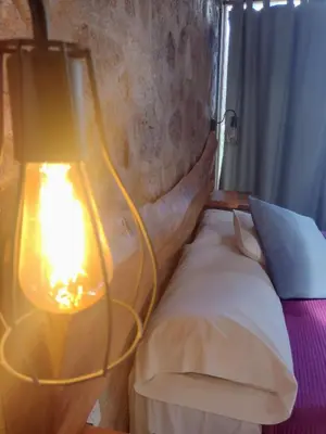 a lamp sitting next to a bed in a room at La Comarca Loft in San Javier