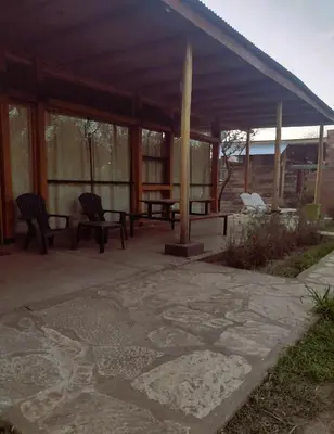 a pavilion with two chairs and a table on a patio at La Comarca Loft in San Javier