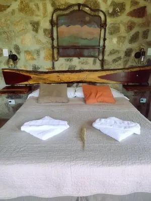 a bed with two towels on top of it at La Comarca Loft in San Javier