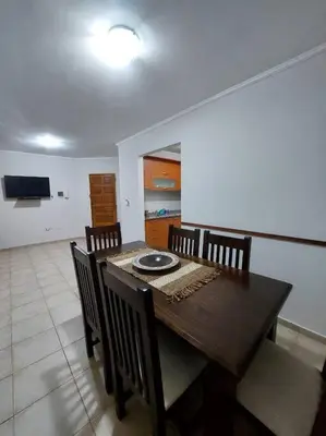 a dining room with a wooden table and chairs at Depto Centro de Carlos Paz in Villa Carlos Paz