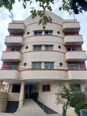 a large building with stairs in front of it at Depto Centro de Carlos Paz in Villa Carlos Paz