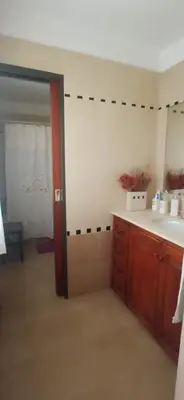 a kitchen with a sink and a counter top at Casa LA SULISA in Merlo