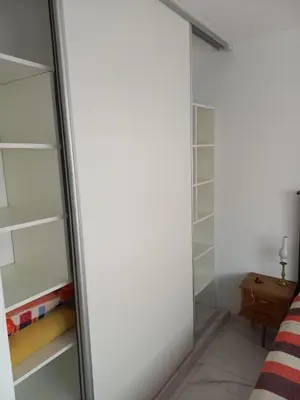 a walk in closet with a glass door at Monserrat in Cordoba