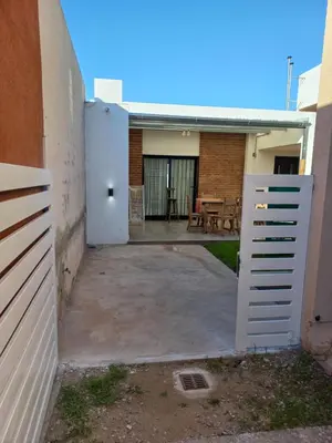 a backyard with a white door and a patio at Monserrat in Cordoba