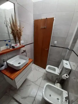a bathroom with a sink and a toilet at Monserrat in Cordoba