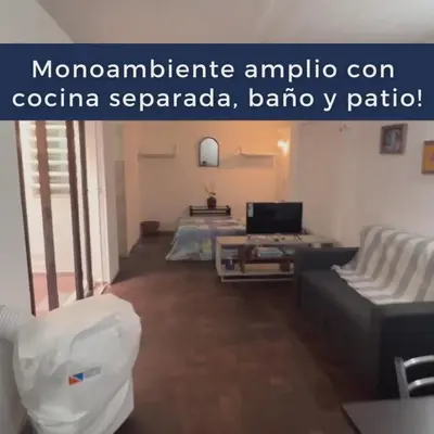 a living room with a couch and a table at Monoambiente Amoblado in Cordoba