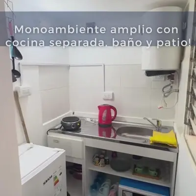 a small kitchen with a stove and a sink at Monoambiente Amoblado in Cordoba