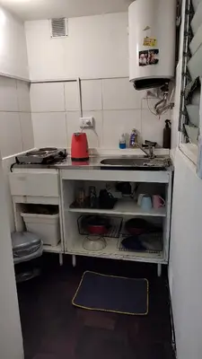 a small kitchen with a counter and a sink at Monoambiente Amoblado in Cordoba