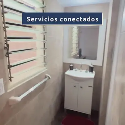 a bathroom with a white sink and a mirror at Monoambiente Amoblado in Cordoba