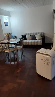 a living room with a table and a couch at Monoambiente Amoblado in Cordoba