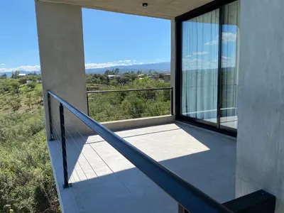a balcony with a view of the mountains at Sol Suites in Villa Cura Brochero
