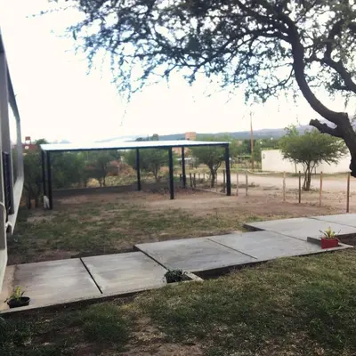 a group of concrete walkways in a park at Sol Suites in Villa Cura Brochero