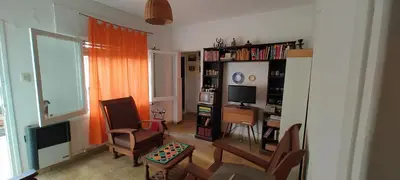 a living room with a couch and a tv and a chair at Habitación Privada en casa compartida, para mujeres, parejas, grupo mixto in Cordoba