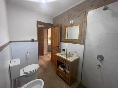 a bathroom with a toilet and a sink at La Peperina in San Javier