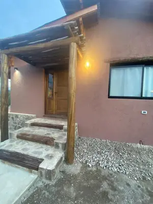 a house with a pathway leading to the front door at La Peperina in San Javier