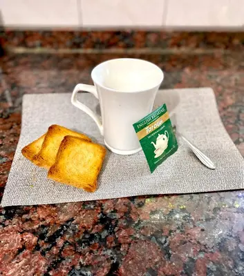 a plate of toast and a cup of coffee at La Casita de la Villa in Villa Carlos Paz