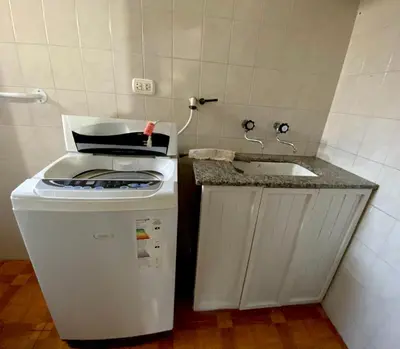 a small kitchen with a sink and a stove at La Casita de la Villa in Villa Carlos Paz