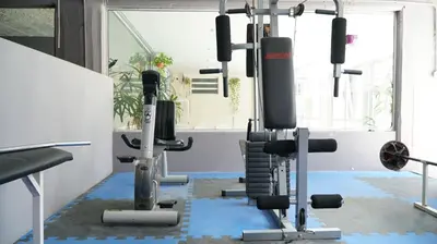 a gym with several tread machines in a room at Aranjuez Real in Villa Carlos Paz