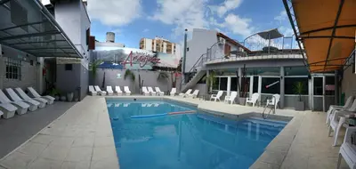 a swimming pool on the side of a building at Aranjuez Real in Villa Carlos Paz