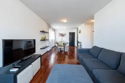 a living room with a couch and a flat screen tv at Lima 823 B General Paz in Cordoba