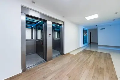 an empty room with glass doors and wooden floors at Lima 823 B General Paz in Cordoba