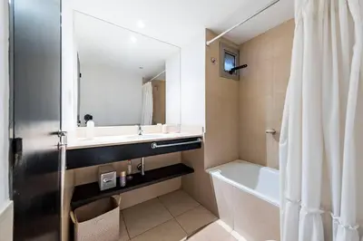 a bathroom with a sink and a tub and a shower at Lima 823 B General Paz in Cordoba